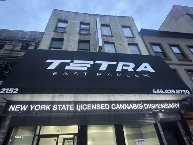 Tetra storefront and signage, East Harlem